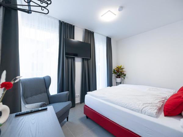 Grazora Living Apartments : photo 9 de la chambre suite supérieure lit king-size