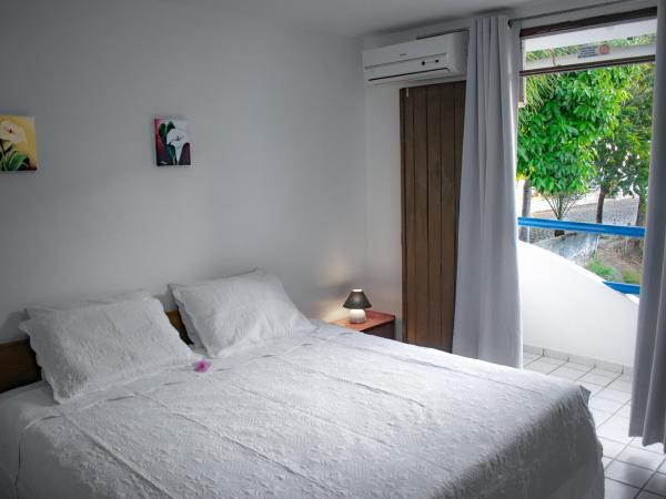 Hotel Pousada Estacao Do Sol Natal : photo 1 de la chambre chambre double ou lits jumeaux - vue latérale sur mer