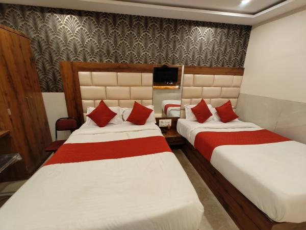 Hotel Dream Palace Residency - Near LBS Marg Kural West : photo 4 de la chambre chambre quadruple