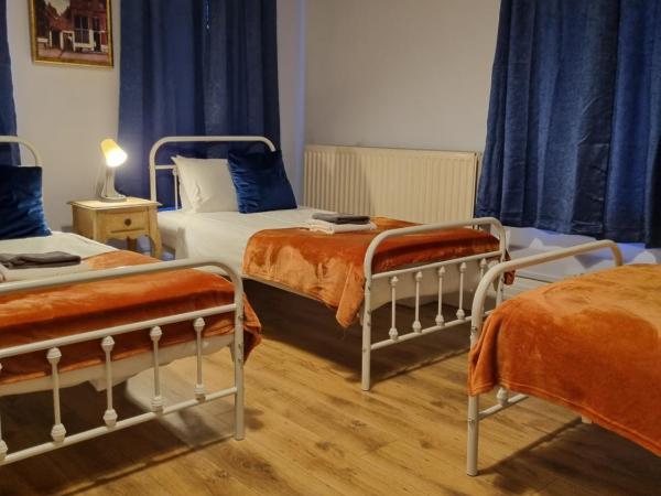 The Windmill Hotel : photo 2 de la chambre chambre triple