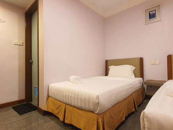 Capital O 90939 Sandakan Central Hotel : photo 4 de la chambre chambre lits jumeaux standard