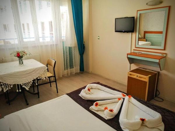Uyum Hotel : photo 4 de la chambre chambre quadruple standard