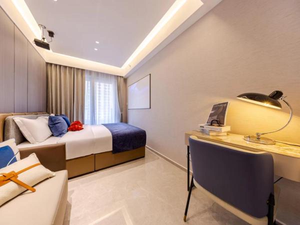 Excellence International Apartment - Convention & Exhibition Center : photo 4 de la chambre chambre lit queen-size deluxe