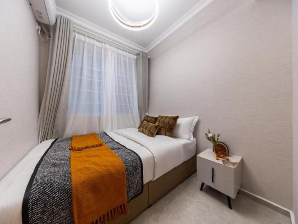 Excellence International Apartment - Convention & Exhibition Center : photo 5 de la chambre suite 2 chambres