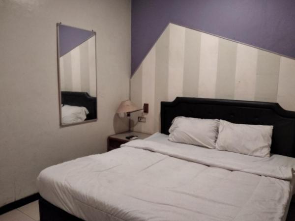 Gangnam Style Residence Mitra RedDoorz near MERR Surabaya : photo 8 de la chambre chambre double deluxe