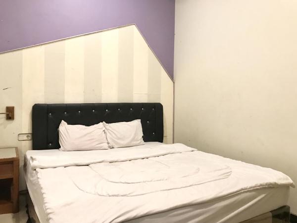 Gangnam Style Residence Mitra RedDoorz near MERR Surabaya : photo 1 de la chambre chambre double standard