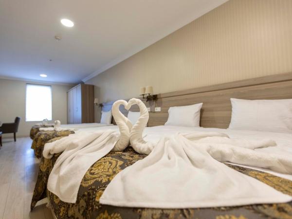 World Point Hotel Besyol : photo 1 de la chambre chambre quadruple standard