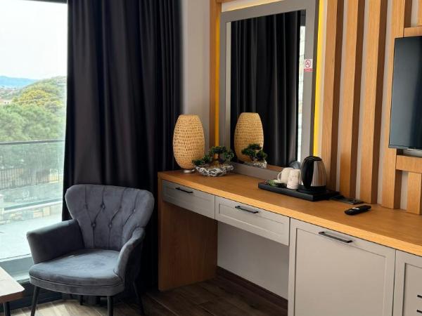 The Rest Port Argento : photo 6 de la chambre chambre triple - vue sur mer