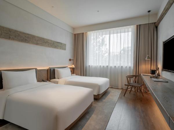 Sahe Hotel Shanghai World Expo : photo 1 de la chambre chambre lits jumeaux - vue sur ville