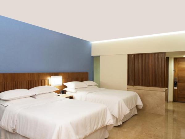 Sheraton Buganvilias Resort & Convention Center : photo 2 de la chambre chambre deluxe avec 2 lits doubles - vue sur jardin - rez-de-chaussée