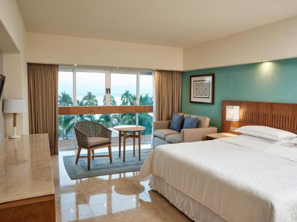 Sheraton Buganvilias Resort & Convention Center : photo 2 de la chambre chambre deluxe avec 1 lit king-size - vue sur océan - Étage intermédiaire