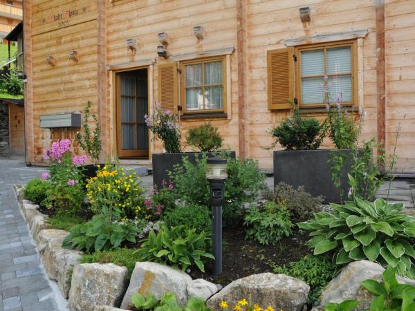 Chalet Alpina Gyger : photo 1 de la chambre chambre lit king-size supérieure