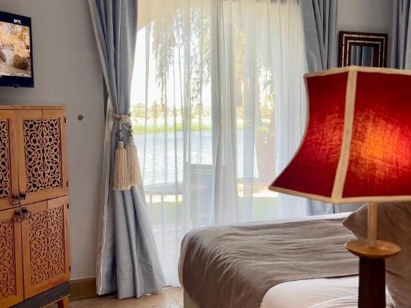 Pavillon du Golf -Palmeraie suites : photo 3 de la chambre suite avec vue sur lac 