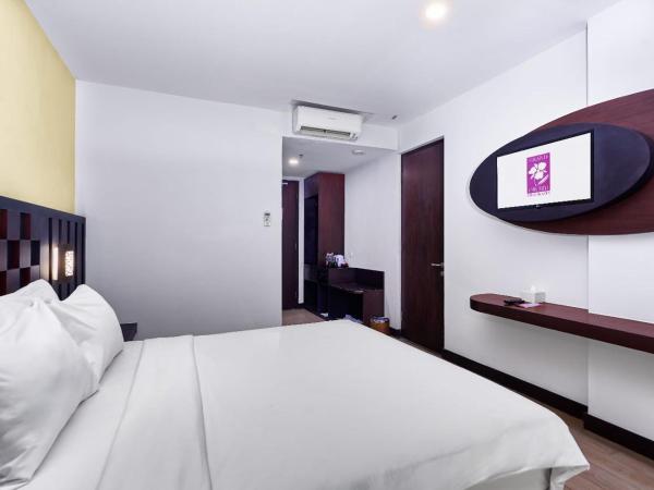 Grand Orchid Hotel Yogyakarta : photo 2 de la chambre chambre lit queen-size deluxe