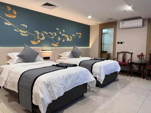 Yixuan Yasi Apartment-free shuttle during the Canton Fari : photo 2 de la chambre chambre lits jumeaux