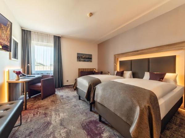 CityClass Hotel am Dom : photo 1 de la chambre chambre lits jumeaux supérieure - vue sur cathédrale