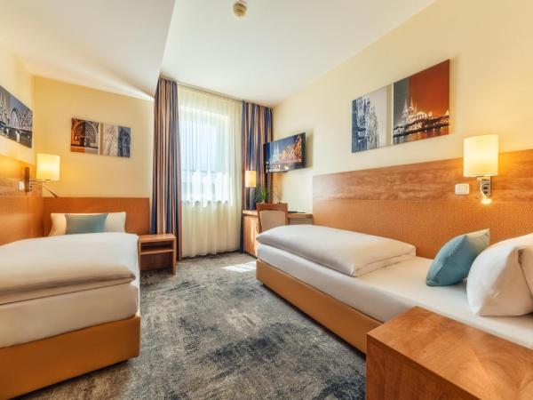 CityClass Hotel am Dom : photo 1 de la chambre chambre lits jumeaux confort