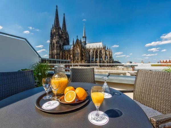 CityClass Hotel am Dom : photo 3 de la chambre suite junior avec terrasse - vue sur cathédrale