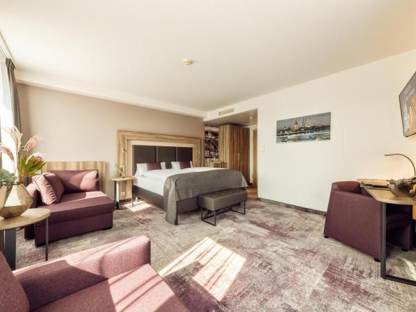 CityClass Hotel am Dom : photo 1 de la chambre suite junior avec terrasse - vue sur cathédrale