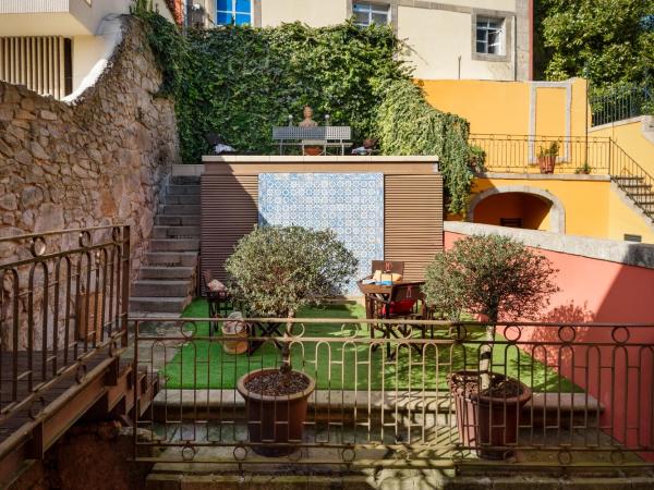 M Maison Particulière Porto : photo 8 de la chambre suite - vue sur jardin