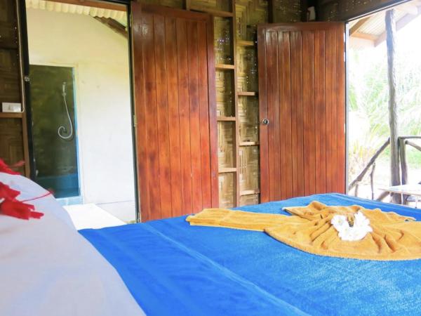 Seaside Sanctuary Bungalows : photo 2 de la chambre bungalow - vue sur jardin