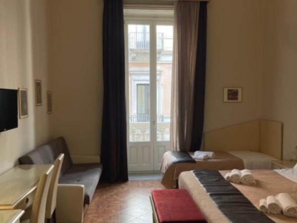 Umberto House Catania : photo 2 de la chambre chambre quadruple standard