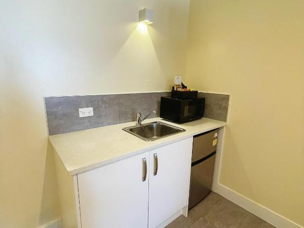 Grand Central Serviced Apartments : photo 8 de la chambre chambre lit king-size deluxe
