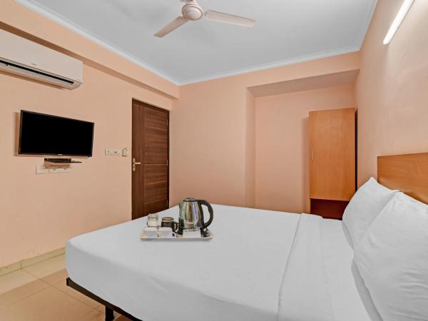 Collection O oyo townhouse : photo 4 de la chambre chambre triple classique