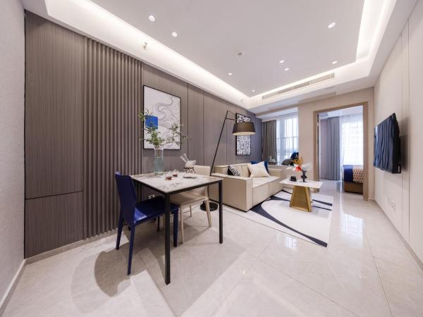 Excellence International Apartment - Convention & Exhibition Center : photo 1 de la chambre chambre supérieure lit queen-size