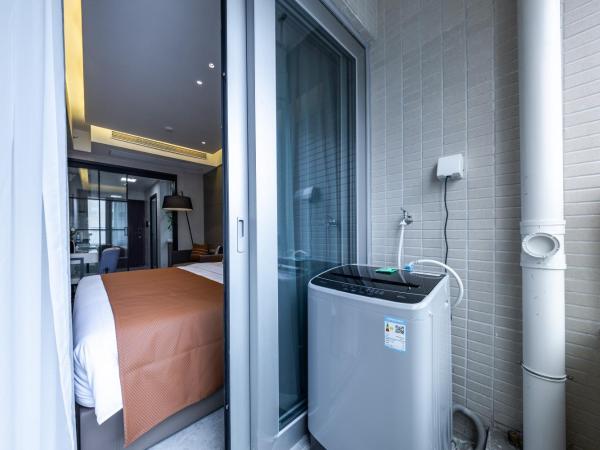 Excellence International Apartment - Convention & Exhibition Center : photo 8 de la chambre chambre lit queen-size deluxe