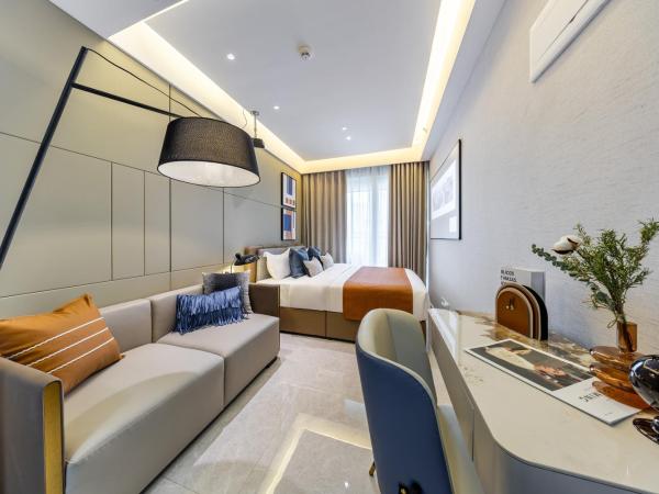 Excellence International Apartment - Convention & Exhibition Center : photo 3 de la chambre chambre lit queen-size deluxe