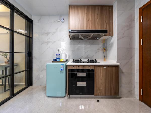 Excellence International Apartment - Convention & Exhibition Center : photo 7 de la chambre chambre lit queen-size deluxe