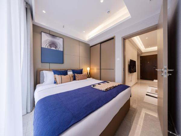 Excellence International Apartment - Convention & Exhibition Center : photo 4 de la chambre chambre supérieure lit queen-size