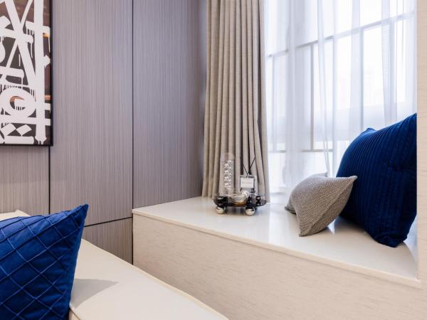 Excellence International Apartment - Convention & Exhibition Center : photo 7 de la chambre chambre supérieure lit queen-size