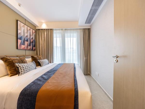 Excellence International Apartment - Convention & Exhibition Center : photo 9 de la chambre light luxury audio-visual one-bedroom and one-bathroom [72-inch projection + tencent membership + large refrigerator + washing machine