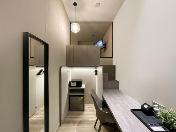 ST Signature Jalan Besar : photo 10 de la chambre cabine m avec lits jumeaux et salle de bains commune