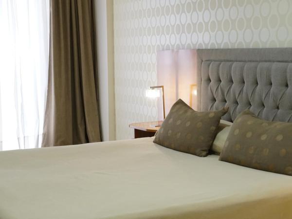 Hotel Howard Johnson Rosario : photo 4 de la chambre chambre lit king-size exécutive