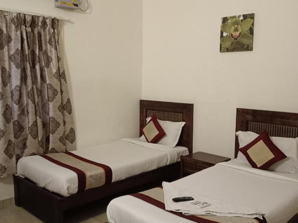 Iris Comfort Inn : photo 2 de la chambre chambre lits jumeaux deluxe