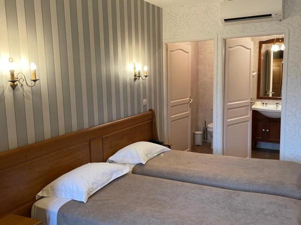 Hotel De La Cloche : photo 1 de la chambre chambre lits jumeaux confort