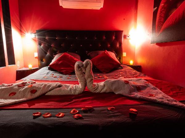 Suite Romantique : photo 7 de la chambre suite lit queen-size pomme d'amour avec baignoire spa