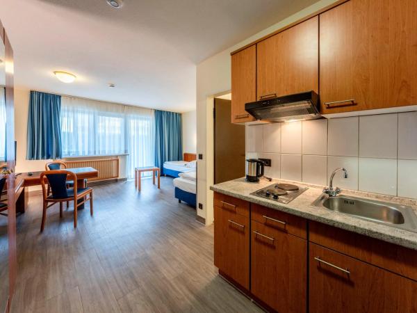 Hotel Am Moosfeld : photo 2 de la chambre appartement