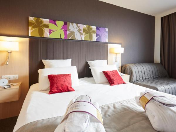 Mercure Valenciennes Centre : photo 7 de la chambre chambre lit king-size privilège avec canapé