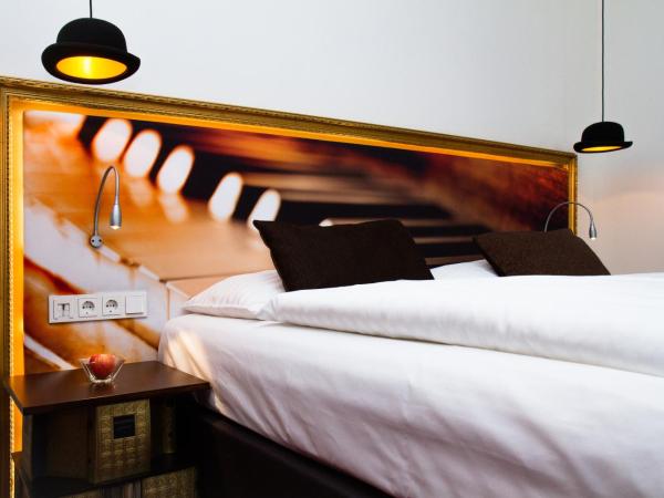 Boutiquehotel Stadthalle : photo 4 de la chambre chambre triple supérieure