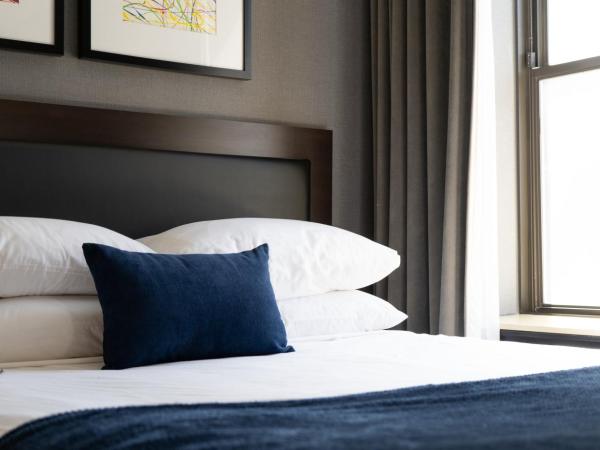 Roomza Inner Harbor at Lord Baltimore : photo 2 de la chambre chambre lit queen-size