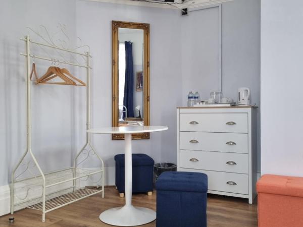 The Windmill Hotel : photo 3 de la chambre chambre triple