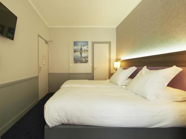 Hôtel Poussin : photo 1 de la chambre chambre double ou lits jumeaux