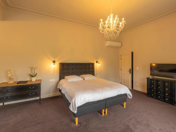 Leyselebeke Castle : photo 4 de la chambre suite - vue sur jardin