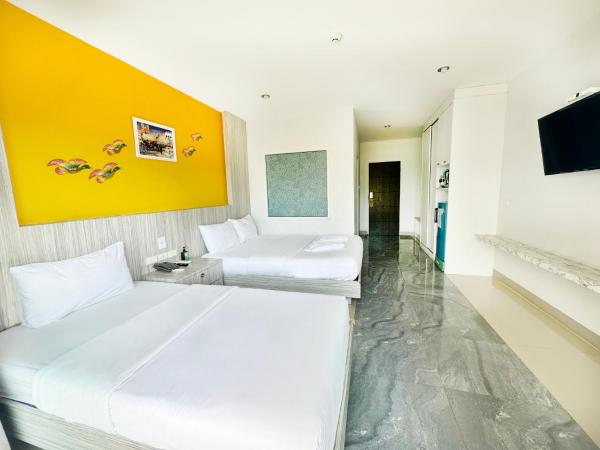 Anantra Pattaya Resort : photo 5 de la chambre chambre lits jumeaux de luxe avec vue sur la piscine