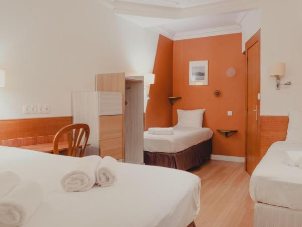 Hôtel Marignan : photo 1 de la chambre chambre quadruple avec toilettes privatives (douche commune au même Étage)