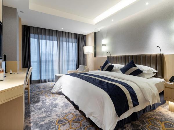 Chongqing Liyuan Hotel : photo 4 de la chambre chambre lit king-size de luxe - vue sur ville - fumeurs